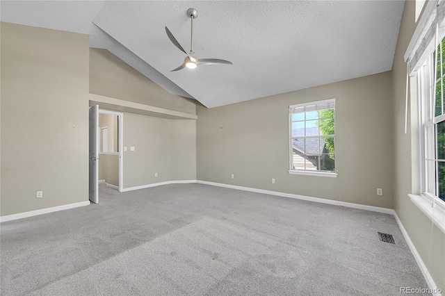 9008 W 101st Ave, Broomfield, CO 80021 - unfurnished room featuring a ceiling fan, a textured ceiling, carpet floors, and vaulted ceiling