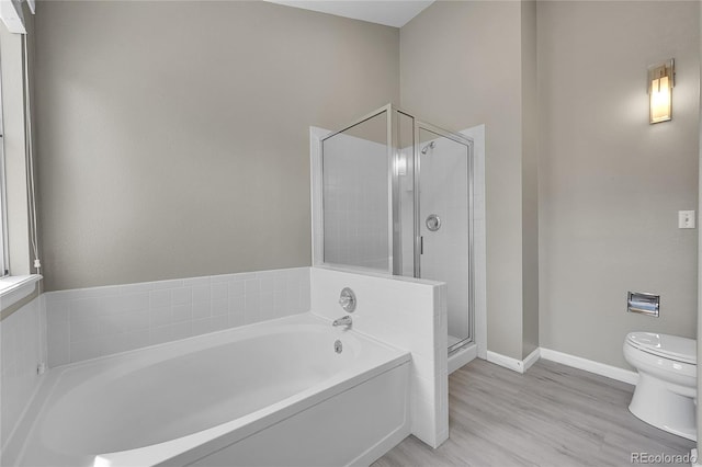 9008 W 101st Ave, Broomfield, CO 80021 - bathroom featuring a garden tub, a stall shower, and wood finished floors