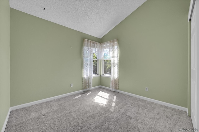 9008 W 101st Ave, Broomfield, CO 80021 - carpeted spare room featuring lofted ceiling and a textured ceiling