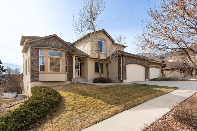 view of front of house featuring a garage and a front yard