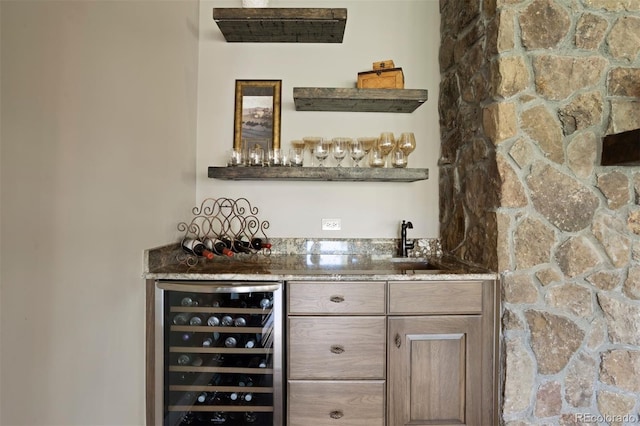 bar featuring wine cooler and sink