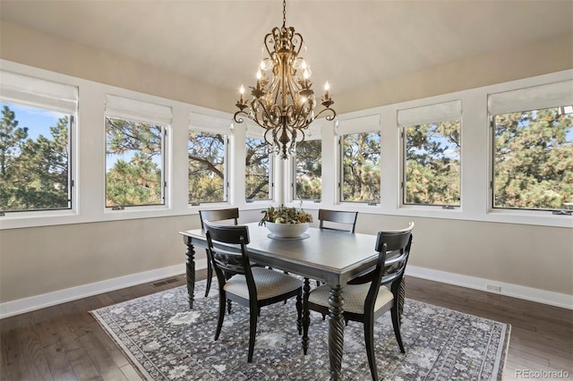 sunroom / solarium with lofted ceiling and a chandelier