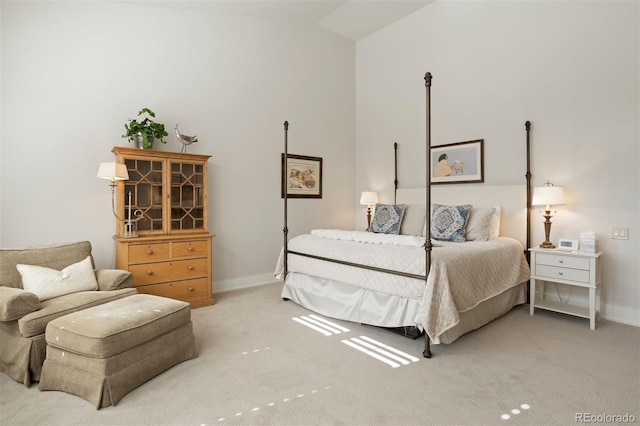 bedroom featuring carpet flooring and vaulted ceiling