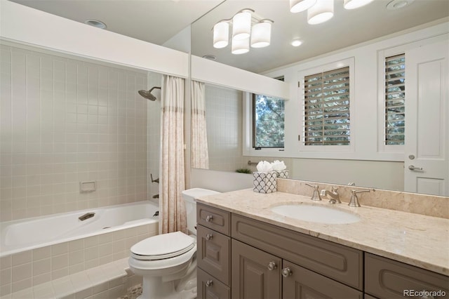 full bathroom featuring vanity, shower / tub combo, and toilet