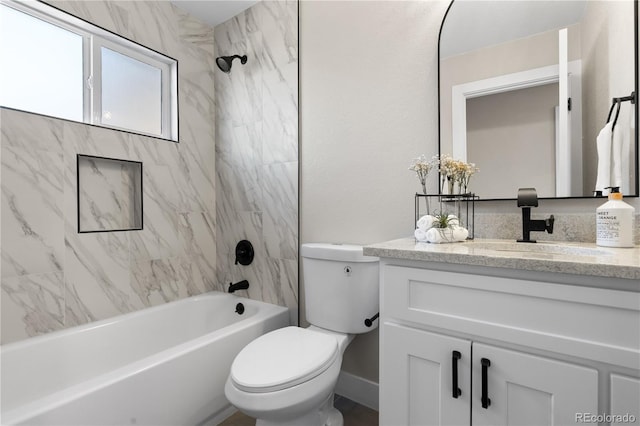 full bathroom with vanity, tiled shower / bath combo, and toilet