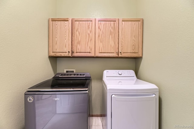 laundry area featuring cabinet space and washer and dryer