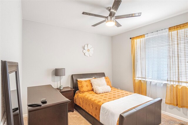 carpeted bedroom with ceiling fan