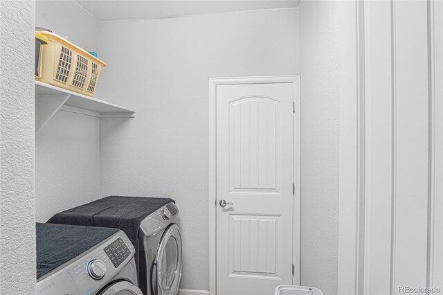 laundry area with washer and dryer