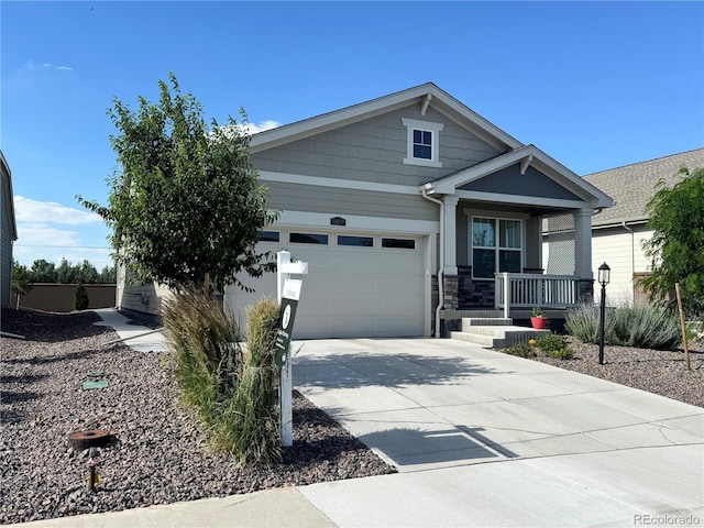 15979 Xanthia Way, Thornton, CO 80602 - craftsman house with covered porch, a garage, driveway, and stone siding