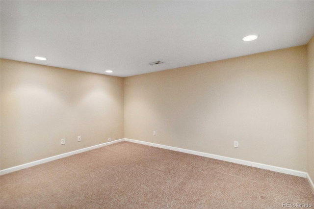 unfurnished room with carpet floors, recessed lighting, and baseboards