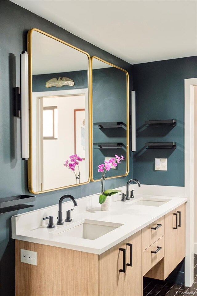 full bath featuring a sink and double vanity