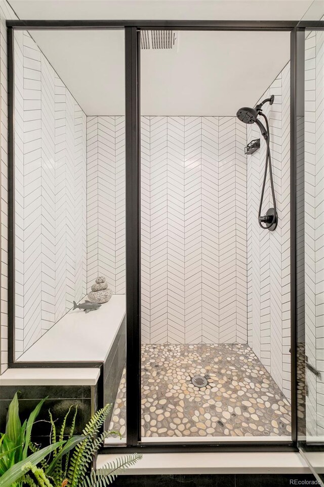 bathroom featuring a shower stall