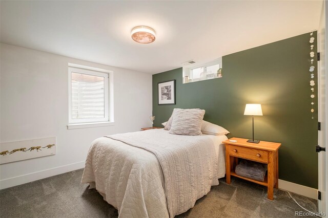carpeted bedroom with baseboards and visible vents