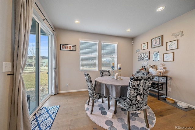 dining area featuring light wood-style flooring, recessed lighting, and baseboards