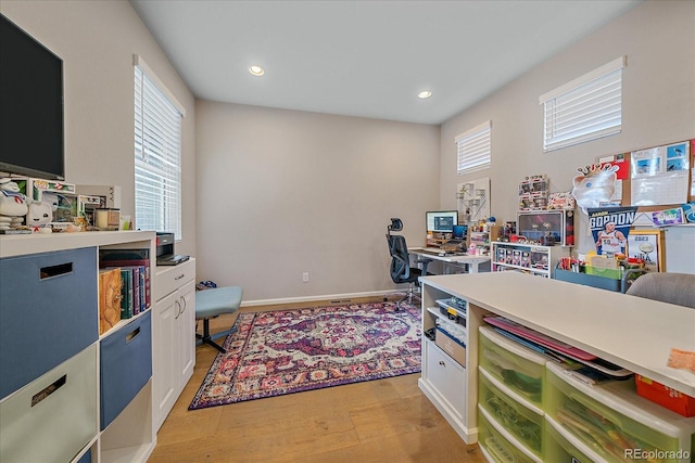 office with recessed lighting and baseboards