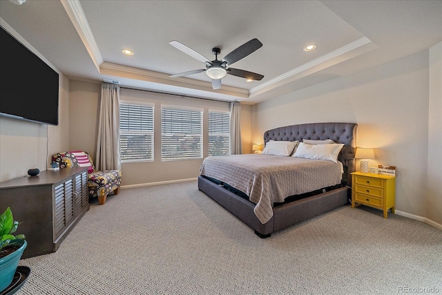 carpeted bedroom with recessed lighting, crown molding, a raised ceiling, and baseboards