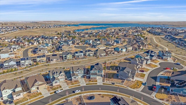 bird's eye view with a residential view and a water view