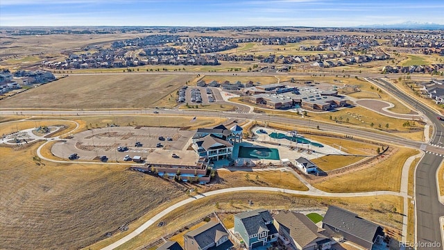 birds eye view of property with a residential view