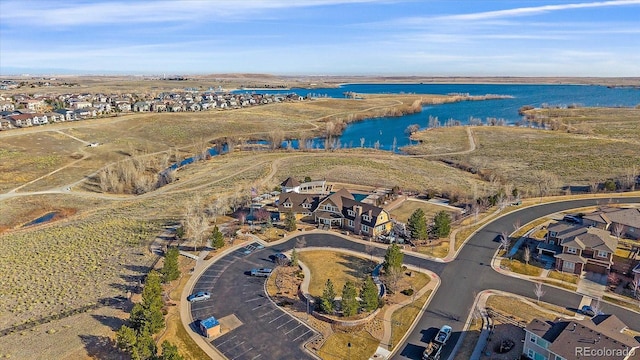 aerial view featuring a water view and a residential view