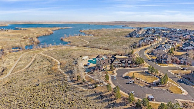 birds eye view of property featuring a water view and a residential view