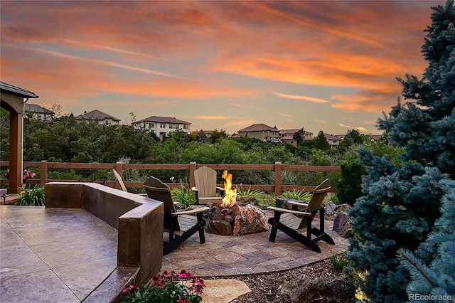 patio terrace at dusk with an outdoor fire pit