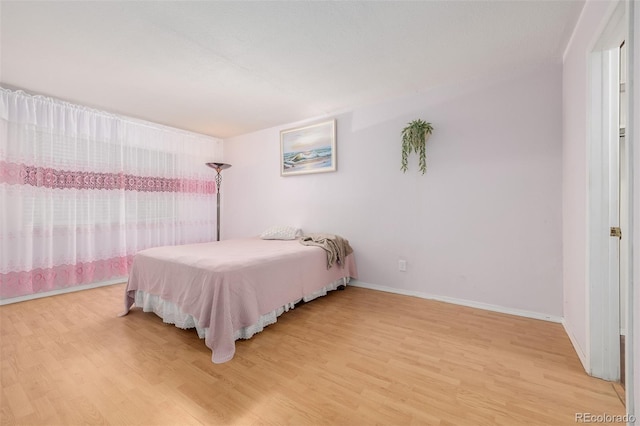 bedroom featuring hardwood / wood-style flooring