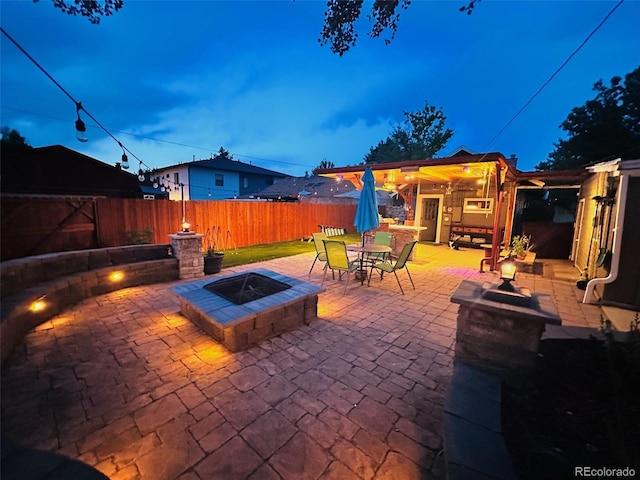 4779 S Bannock St, Englewood, CO 80110 - fenced backyard featuring a fire pit, a patio area, and outdoor dining area