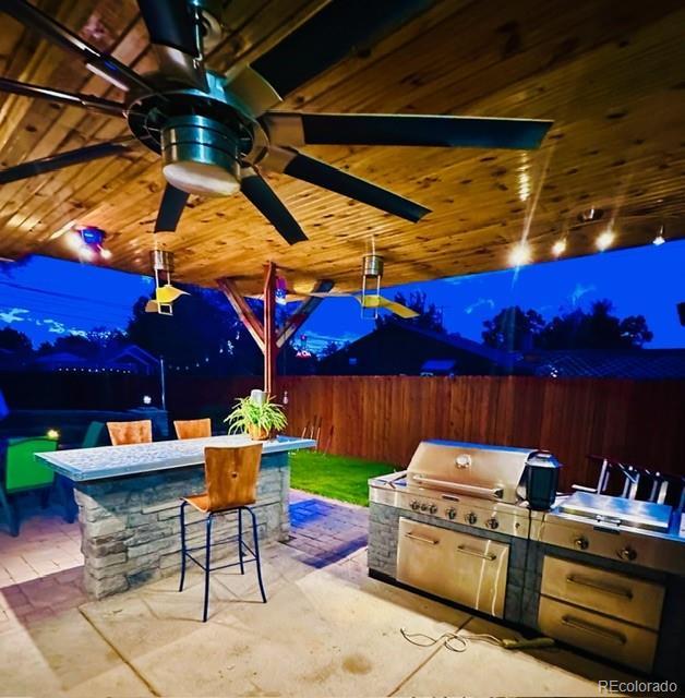 4779 S Bannock St, Englewood, CO 80110 - view of patio featuring area for grilling and a ceiling fan