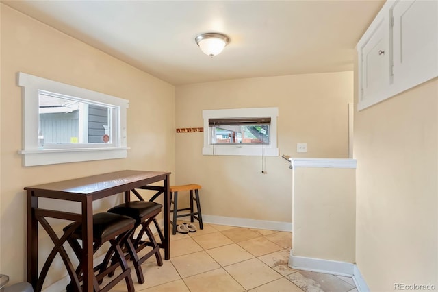4779 S Bannock St, Englewood, CO 80110 - dining room featuring light tile patterned floors and baseboards