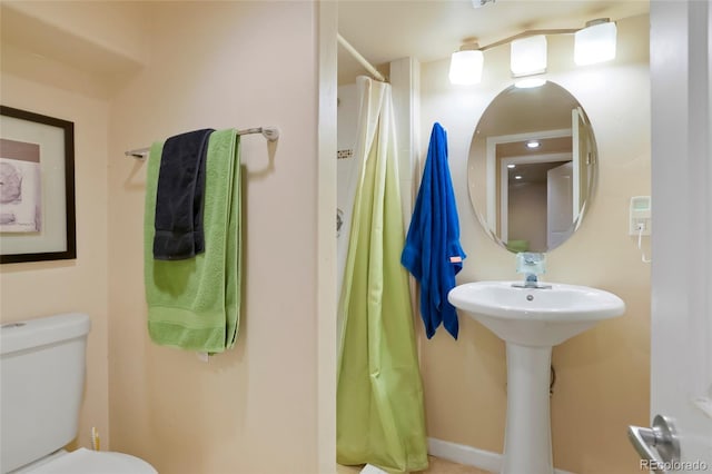 4779 S Bannock St, Englewood, CO 80110 - bathroom with toilet and a shower with shower curtain