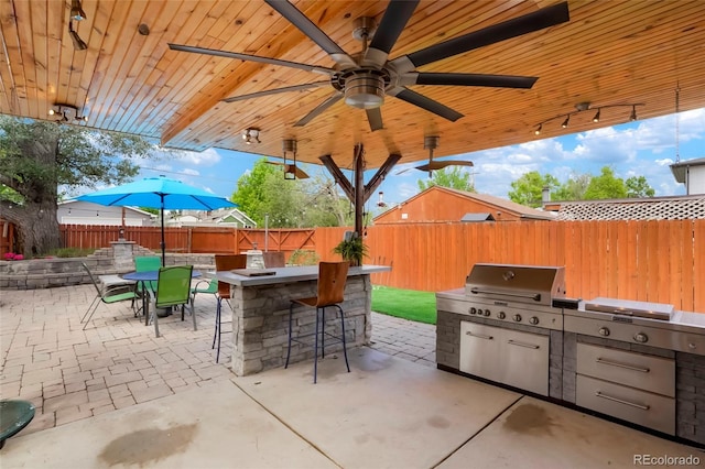 4779 S Bannock St, Englewood, CO 80110 - fenced backyard featuring a patio and a ceiling fan