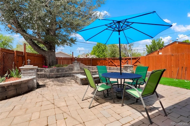 4779 S Bannock St, Englewood, CO 80110 - fenced backyard with outdoor dining space and a patio