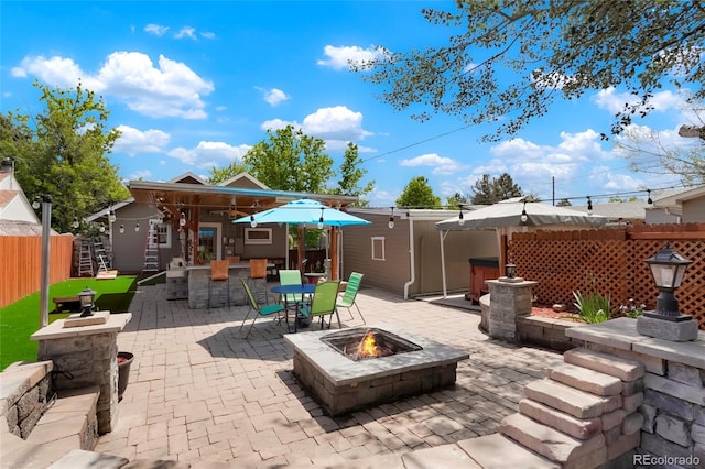4779 S Bannock St, Englewood, CO 80110 - view of patio / terrace with an outdoor fire pit and outdoor dining space