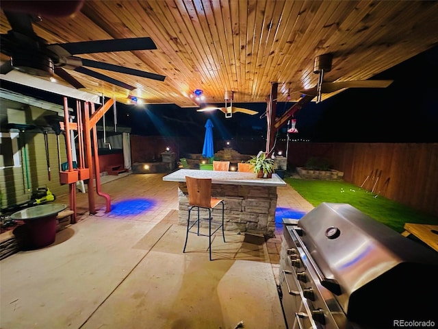 4779 S Bannock St, Englewood, CO 80110 - fenced backyard with ceiling fan and a patio