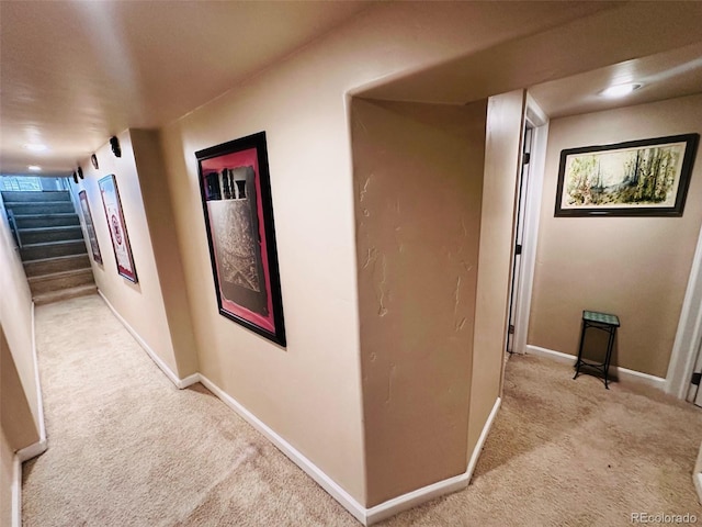 4779 S Bannock St, Englewood, CO 80110 - hallway with light colored carpet, baseboards, and stairs