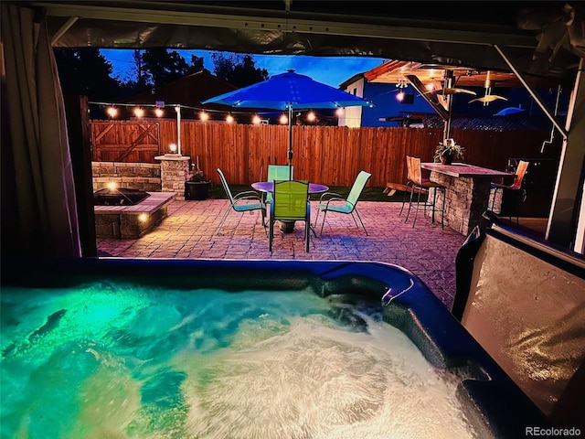 4779 S Bannock St, Englewood, CO 80110 - view of swimming pool with a fire pit, an outdoor hot tub, and a patio