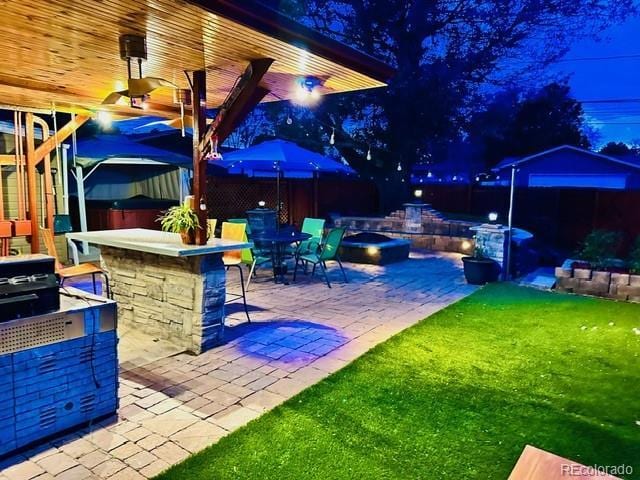 4779 S Bannock St, Englewood, CO 80110 - view of patio / terrace featuring a fire pit