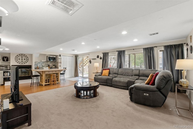 13131 Pennsylvania St, Thornton, CO 80241 - living area featuring visible vents, recessed lighting, and light wood-type flooring