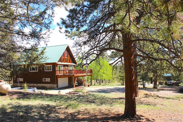 975 Windmill Dr, Hartsel, CO 80449 - view of yard with a garage and a deck