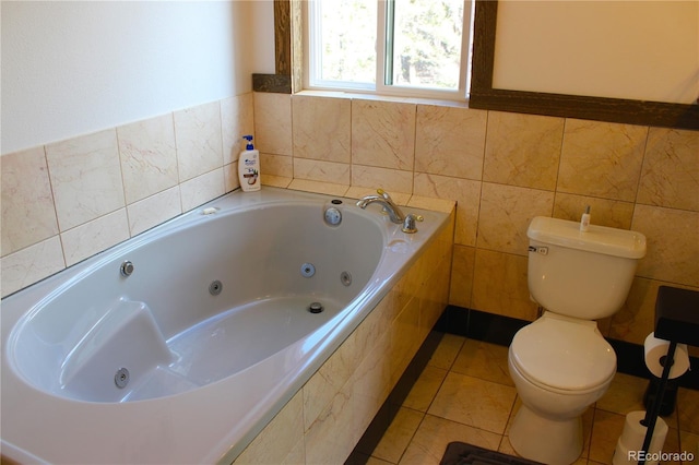 975 Windmill Dr, Hartsel, CO 80449 - bathroom featuring toilet, a tub with jets, and tile patterned floors