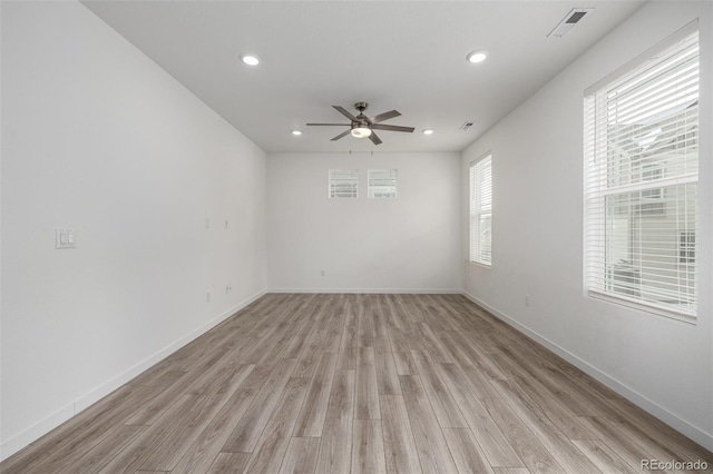 empty room featuring ceiling fan and light wood-type flooring