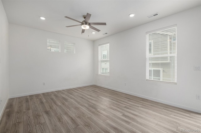 unfurnished room with ceiling fan and light hardwood / wood-style flooring