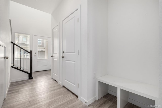 mudroom with light hardwood / wood-style flooring