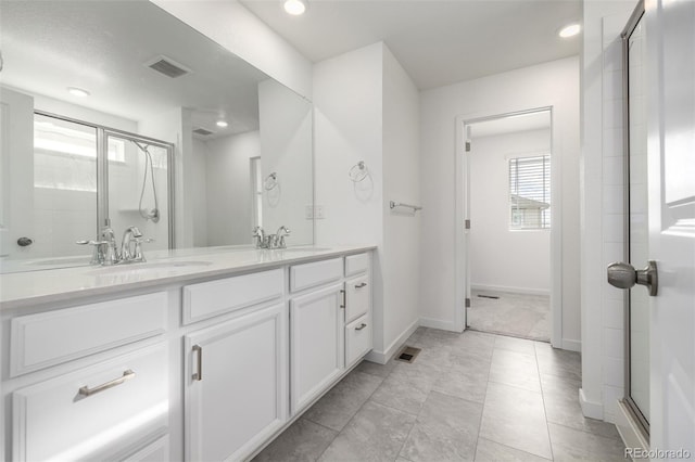 bathroom with vanity and walk in shower