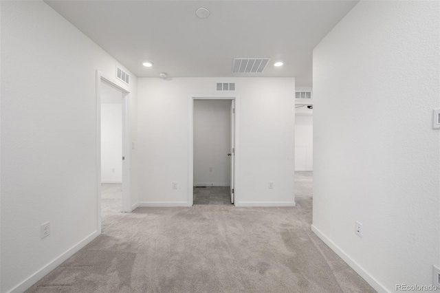 empty room with light colored carpet