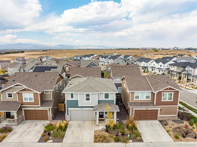 drone / aerial view featuring a mountain view