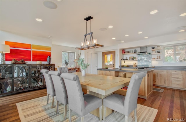 dining room featuring wood finished floors and recessed lighting