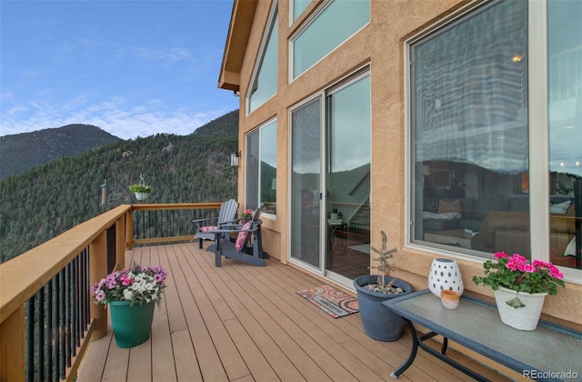 wooden terrace with a mountain view