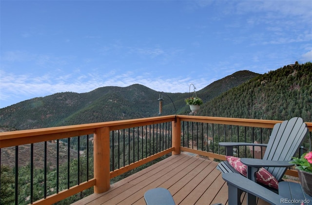 wooden deck featuring a mountain view