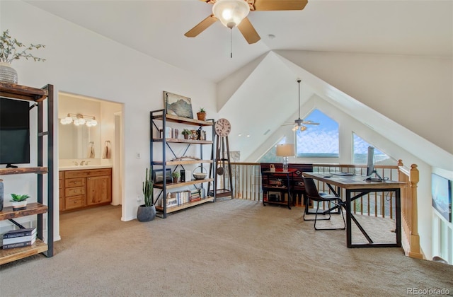 office space with light carpet, ceiling fan, and lofted ceiling